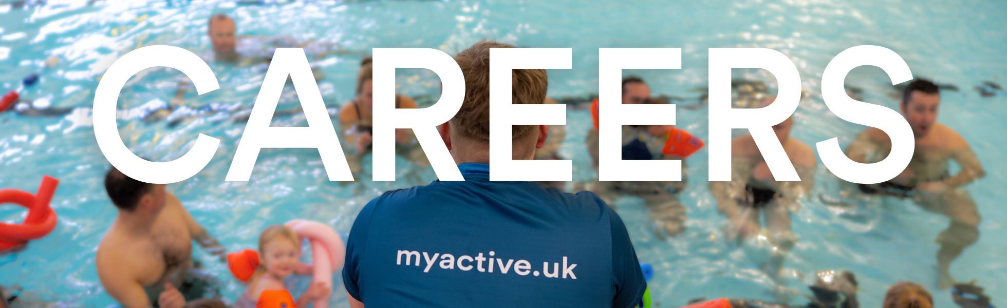 Careers. Image of a swimming teacher facing a parent and toddler swimming class in a pool